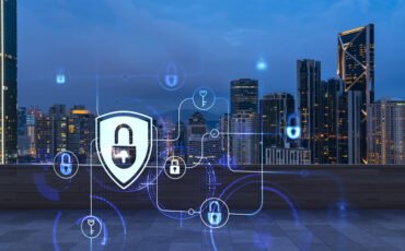 Rooftop with wooden terrace, Kuala Lumpur night skyline. Cyber security concept to protect clients confidential information. IT hologram padlock icons. City downtown. Double exposure.