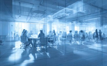 Business people in a modern office. Blue toned image double exposure